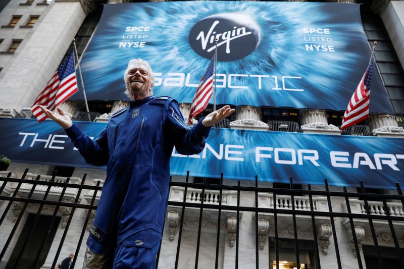FILE PHOTO: Sir Richard Branson stands outside the New York Stock Exchange (NYSE) ahead of Virgin Galactic (SPCE) IPO in New York