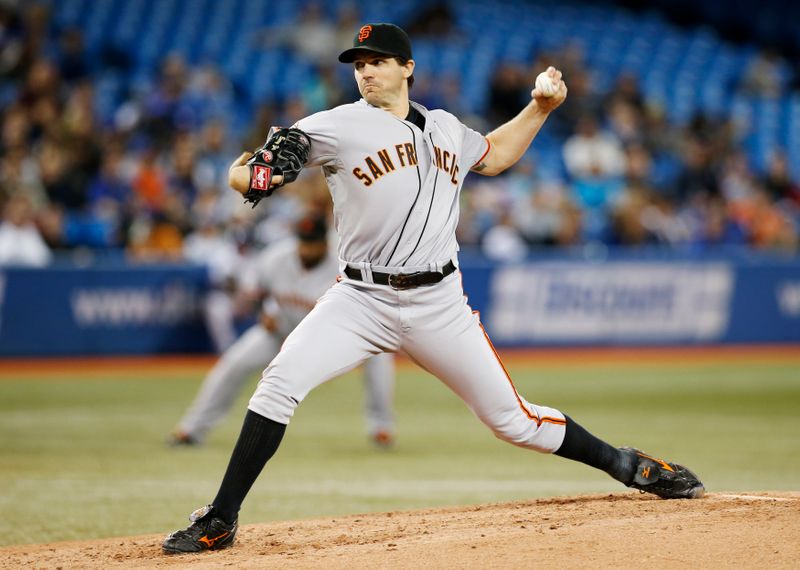 FILE PHOTO: San Francisco Giants' Zito pitches to Toronto Blue Jays during MLB American League baseball game in Toronto