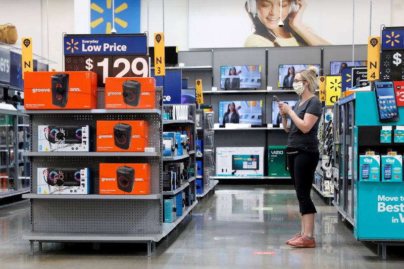FILE PHOTO: A shopper is seen wearing a mask while shopping at a Walmart store in Bradford, Pennsylvania