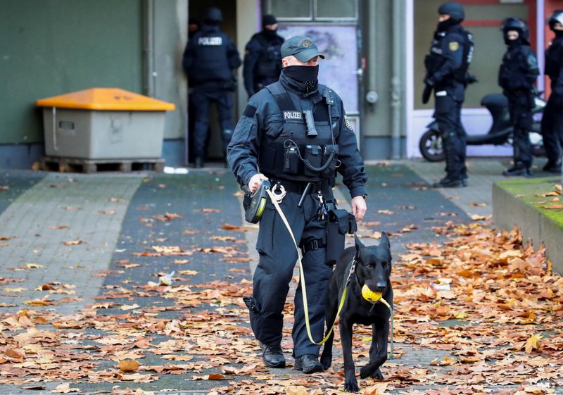 German police secure the area during raids in Berlin