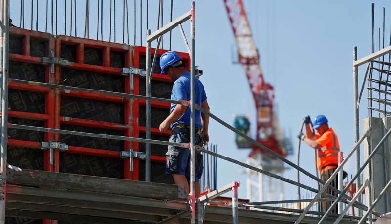 Construction workers prepare concrete formworks in Berlin