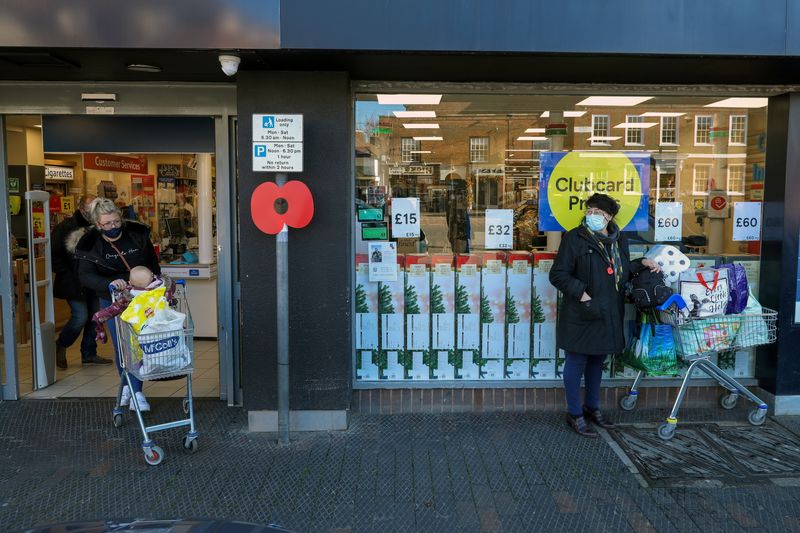 People stock up with items from a Tesco supermarket in West Malling