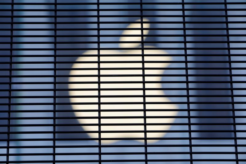 The Apple logo is seen through a security fence erected around the Apple Fifth Avenue store