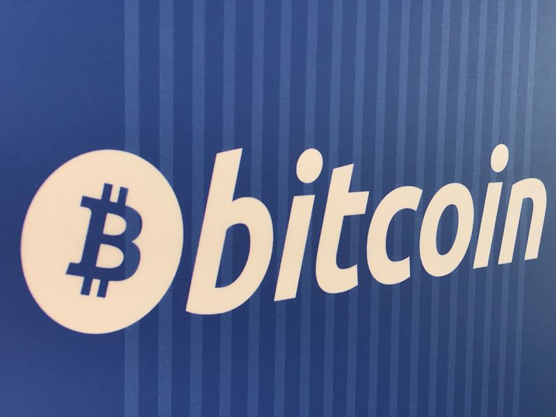 FILE PHOTO: A Bitcoin logo is seen on a cryptocurrency ATM in Santa Monica