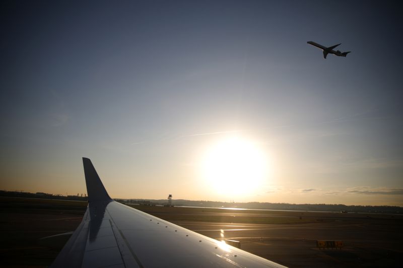 An airplane takes off from the Ronald Reagan National Airport as air traffic is affected by the spread of the coronavirus disease (COVID-19), in Washington