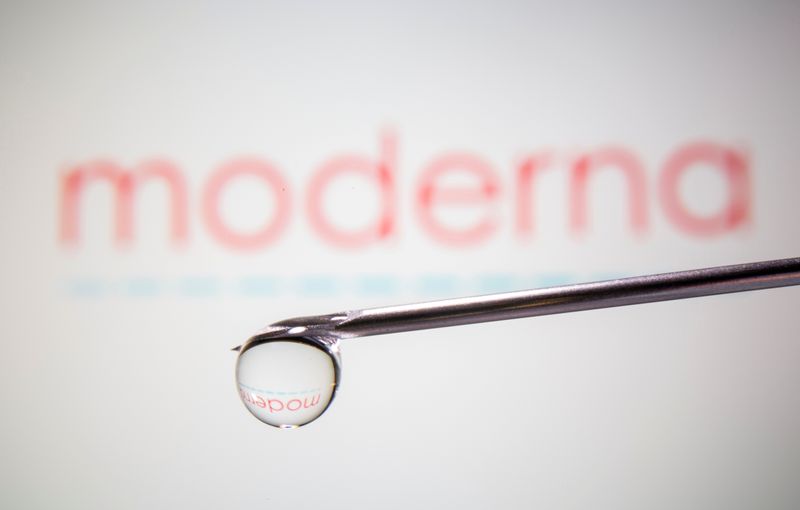 FILE PHOTO: Moderna's logo is reflected in a drop on a syringe needle in this illustration