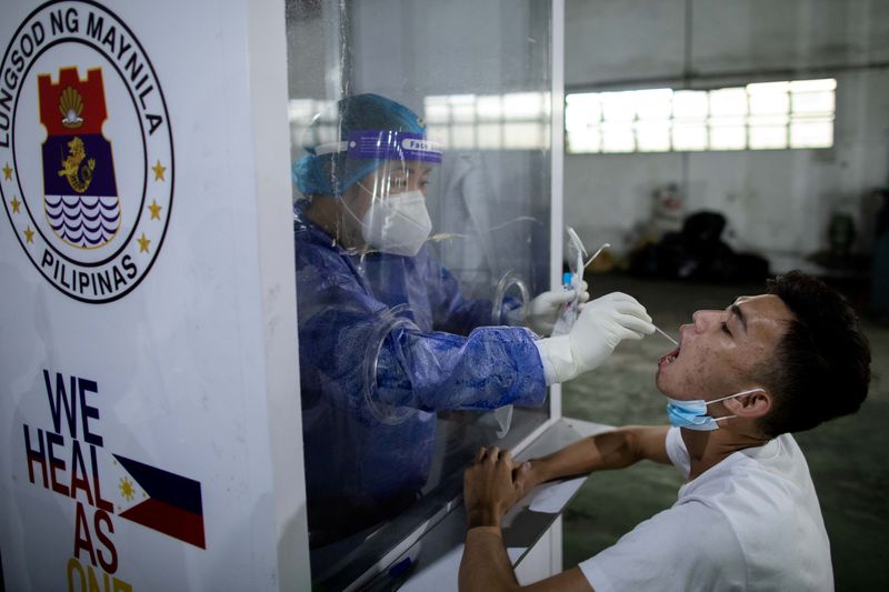 FILE PHOTO: Free COVID-19 swab testing for public market vendors in Manila