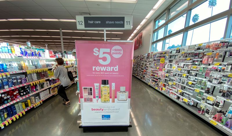 A person wearing a protective mask browses the hair care isle at a Walgreens store during the outbreak of the coronavirus disease (COVID-19), in Pasadena