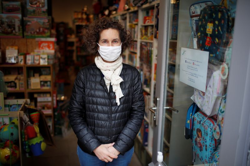 On a street in Paris, struggling shops get creative to survive