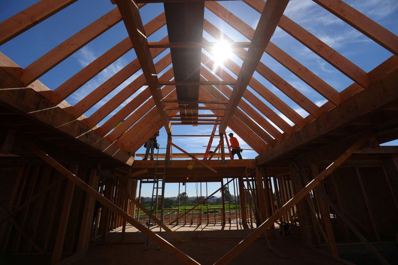 Construction workers build a single family home in San Diego, California