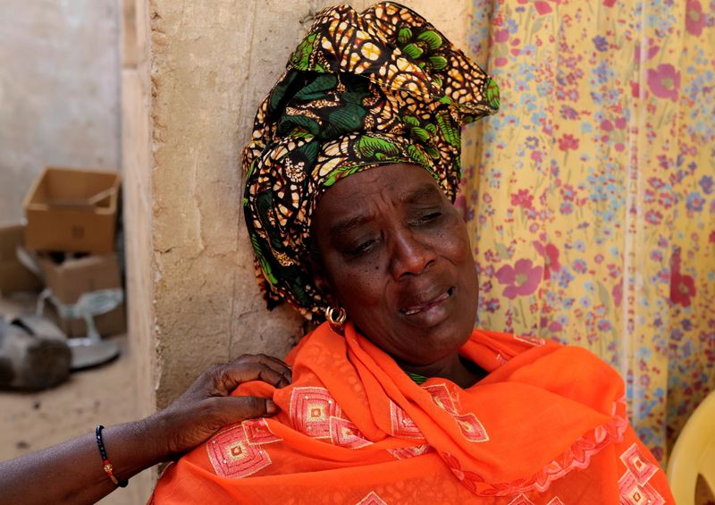 Gueye, whose son drowned at sea two weeks ago while trying to reach the Canary Islands, reacts during an interview with Reuters at her house in Tivaouane