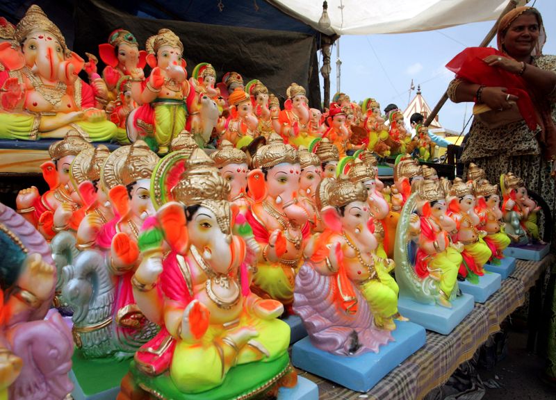 FILE PHOTO: A devotee buys an idol of Hindu elephant God Lord Ganesha in Ahmedabad