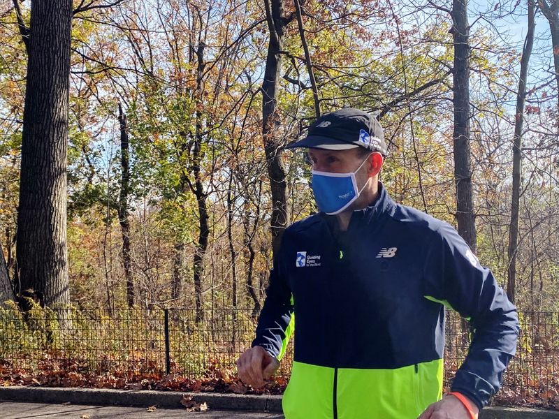 Thomas Panek, a blind runner and CEO of Guiding Eyes for the Blind, gets ready for a 5K run in Central Park where he will use Google's