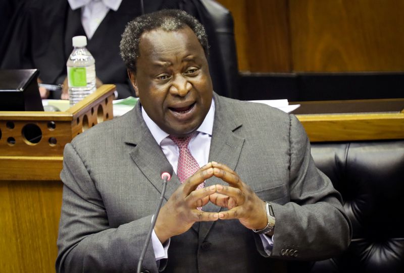 FILE PHOTO: South African Finance Minister Tito Mboweni gestures as he delivers his budget speech at the parliament in Cape Town