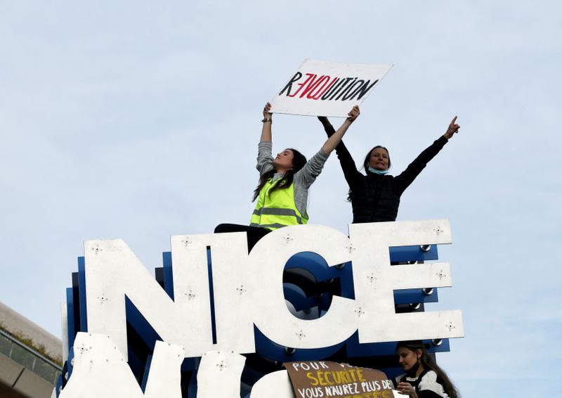 People attend a demonstration to protest against a bill that would make it a crime to circulate an image of a police officer's face, in Nice