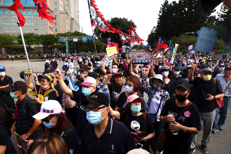 People join a protest to oppose the import of U.S. pork containing ractopamine, an additive that enhances leanness in Taipei