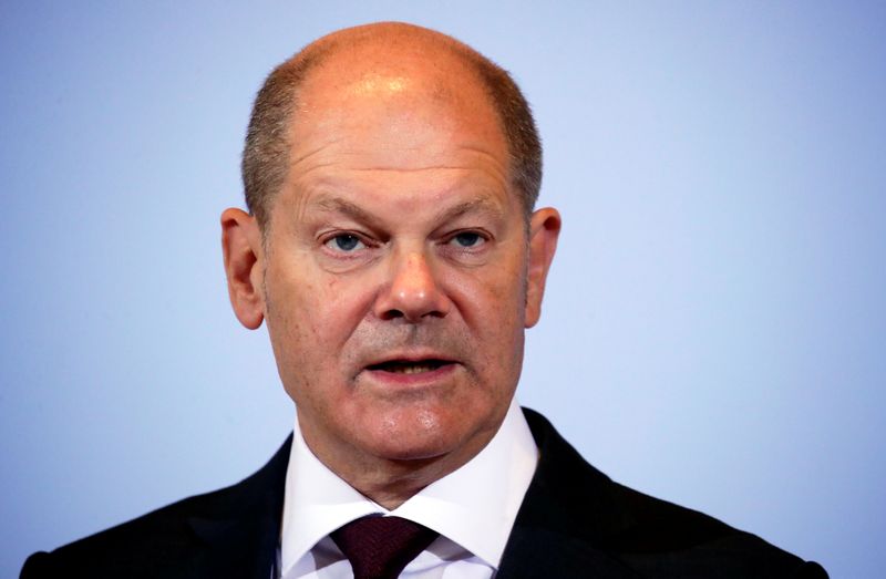 FILE PHOTO: German Finance Minister Scholz and Justice Minister Lambrecht hold news conference in Berlin
