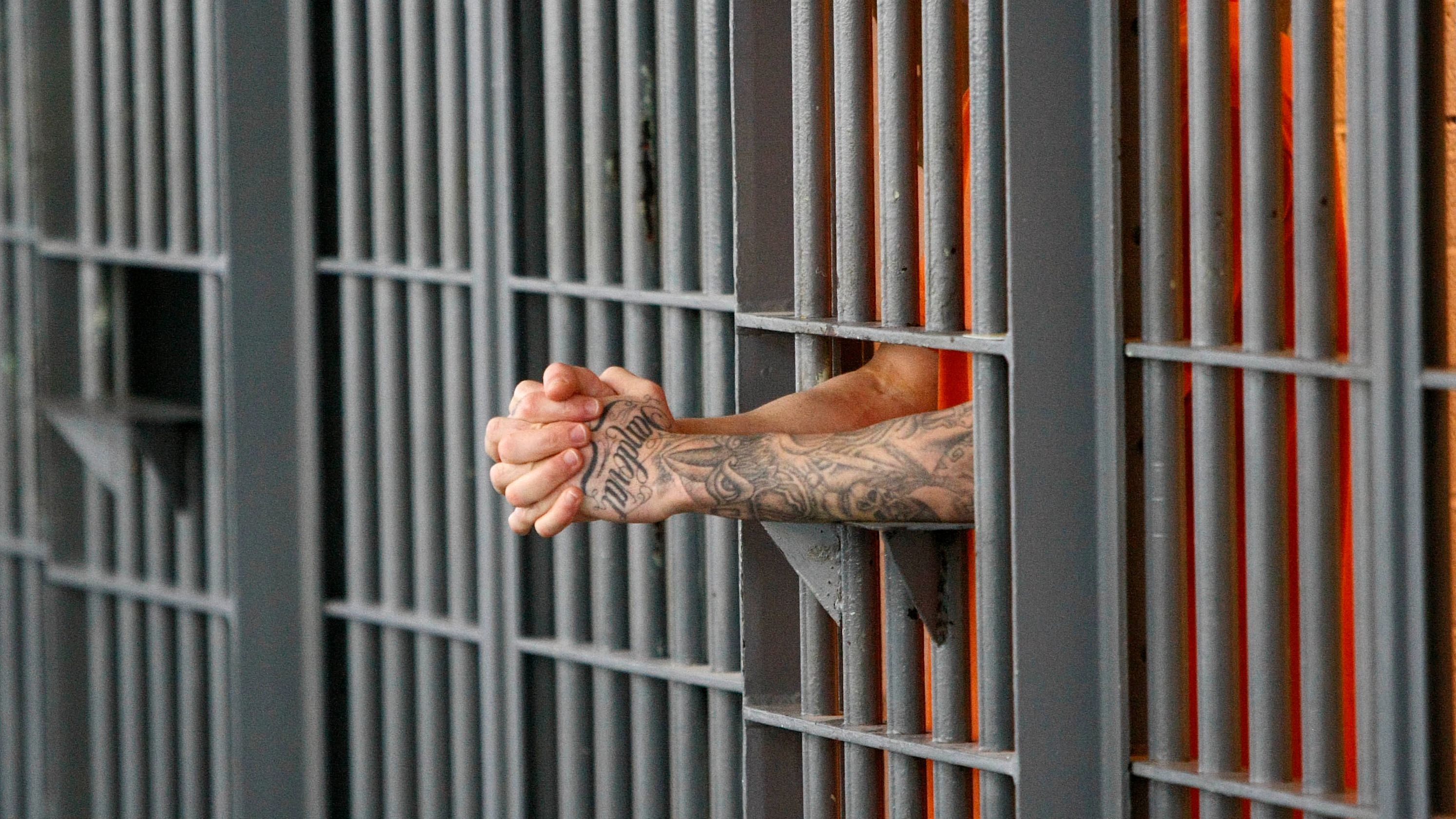 An inmate stands at his cell door at a maximum security facility in Arizona