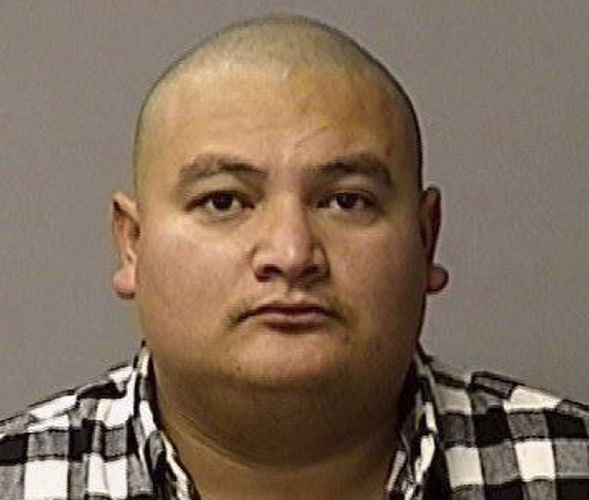 Man suspected of killing police officer charged with murder