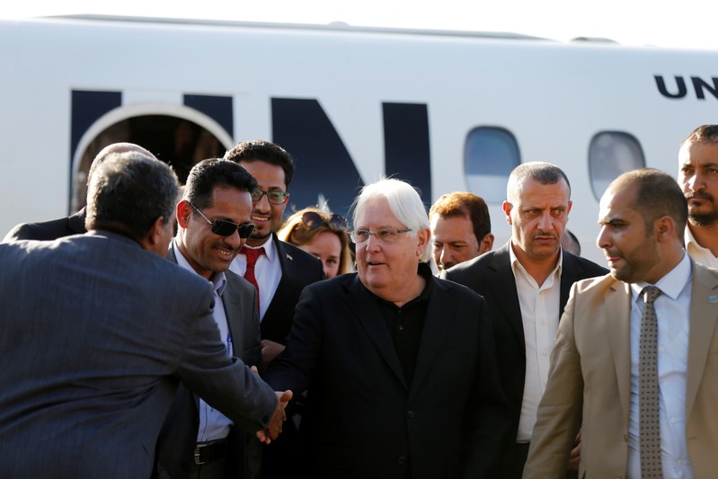 United Nations envoy to Yemen, Martin Griffiths, shakes hands with Houthi officials upon his arrival at Sanaa airport in Sanaa, Yemen