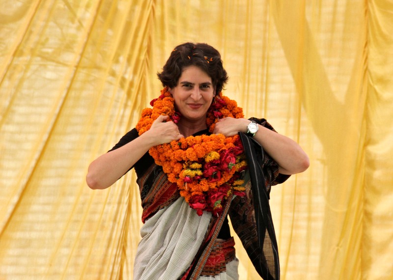 FILE PHOTO: Priyanka Gandhi Vadra adjusts her flower garlands during an election meeting at Rae Bareli