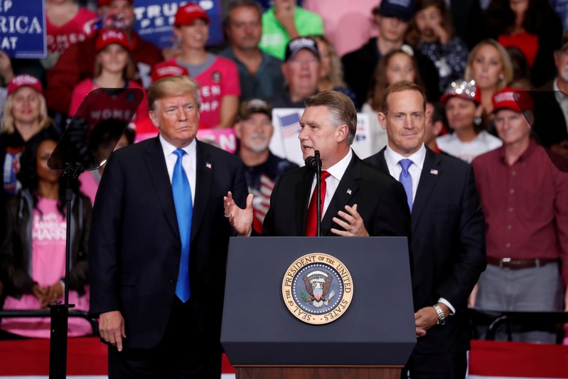 FILE PHOTO: Harris, Republican candidate from North Carolina's 9th Congressional district speaks as U.S. President Trump looks on during a campaign rally in Charlotte