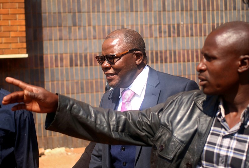 FILE PHOTO - Zimbabwe's former finance minister and opposition leader Tendai Biti looks on after appearing at the Magistrate Court in the capital Harare