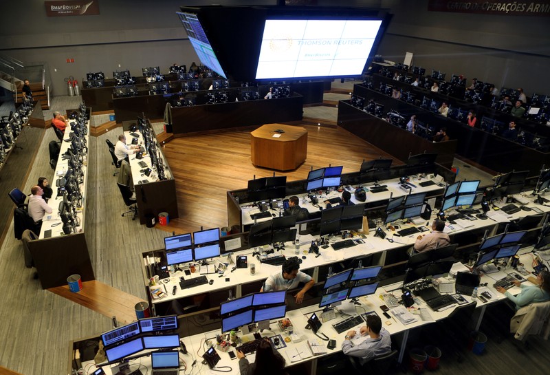 FILE PHOTO: Traders work at the floor of Brazil's BM&F Bovespa Stock Market in downtown Sao Paulo