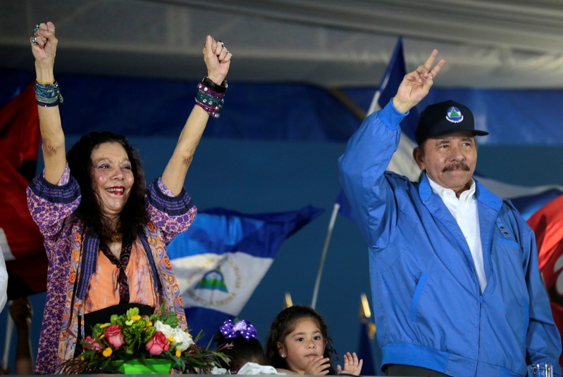 Nicaraguan President Ortega and Vice-President Murillo greet supporters during a march in Managua