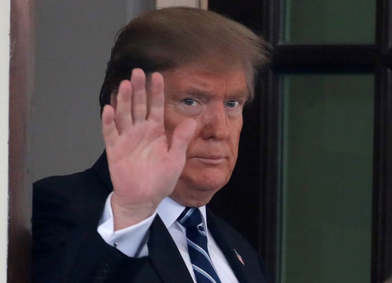 U.S. President Donald Trump waves as Austrian Chancellor Sebastian Kurz departs at the White House in Washington