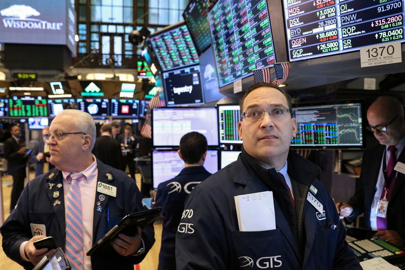 Traders work on the floor of the NYSE in New York