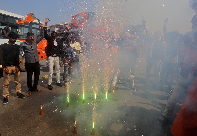 Supporters of India's ruling BJP light fireworks to celebrate after Indian authorities said their jets conducted airstrikes on militant camps in Pakistani territory, in Prayagraj