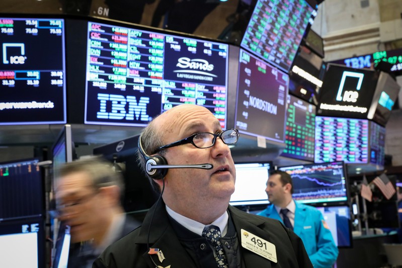 Traders work on the floor of the NYSE in New York