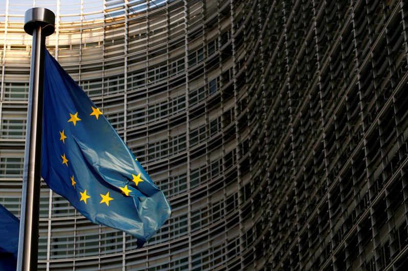 FILE PHOTO: A EU flag is seen outside the EU Commission headquarters in Brussels