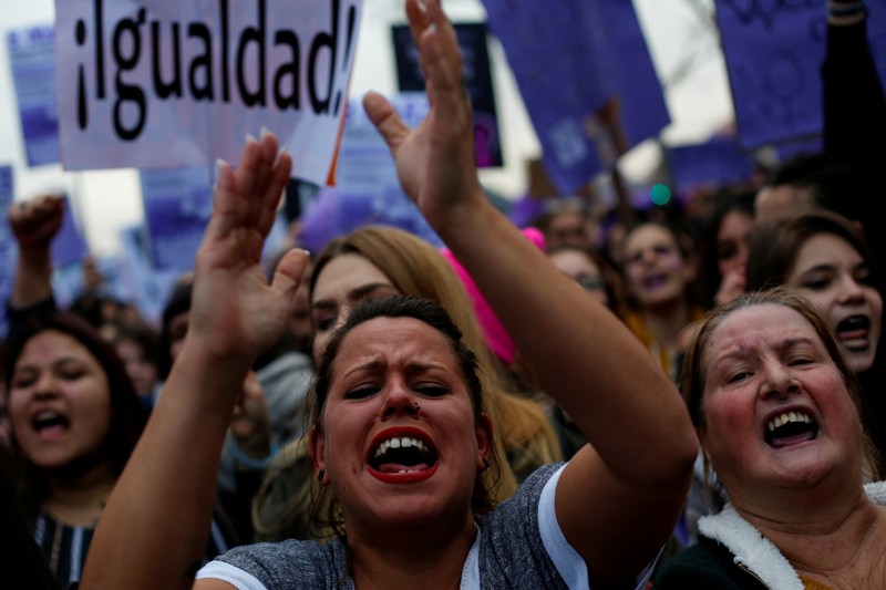FILE PHOTO: Protesters take part in a demonstration during a nationwide feminist strike on International Women's Day in Madrid