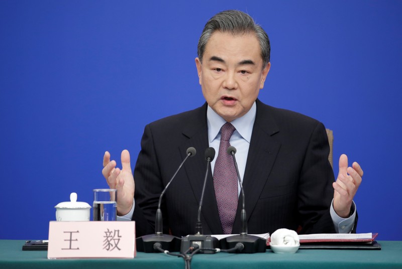 Chinese Foreign Minister Wang Yi attends a news conference during ongoing session of the NPC in Beijing