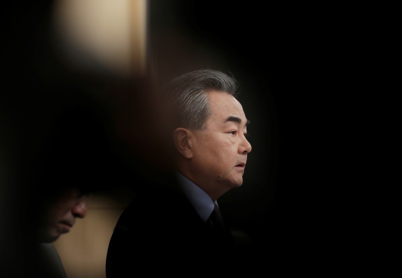 Chinese Foreign Minister Wang Yi attends a news conference during ongoing session of the NPC in Beijing