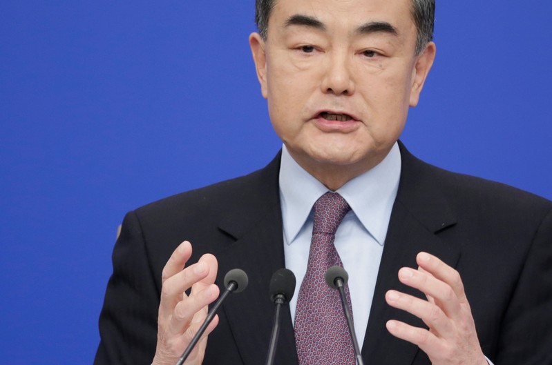 Chinese Foreign Minister Wang Yi attends a news conference during ongoing session of the NPC in Beijing