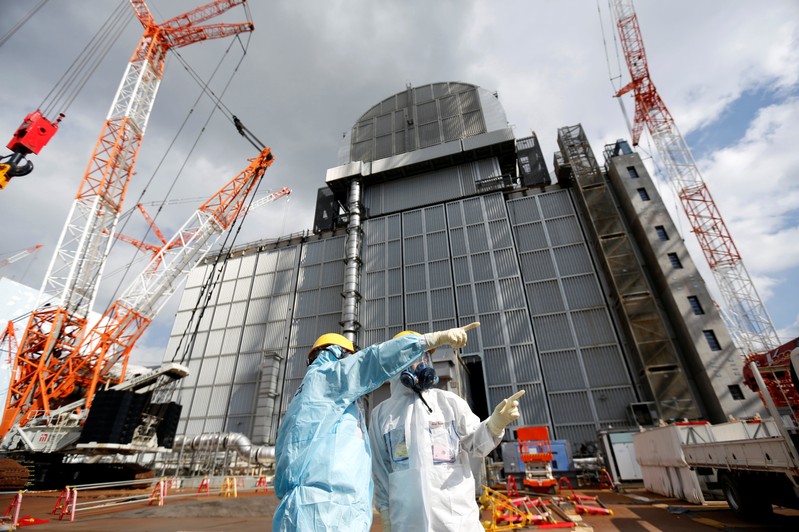 An TEPCO employee gives lectures at tsunami-crippled Fukushima Daiichi nuclear power plant in Okuma town, Fukushima prefecture