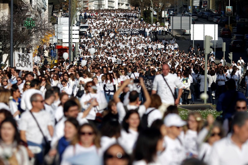 Nurses are seen during a protest march in Lisbon