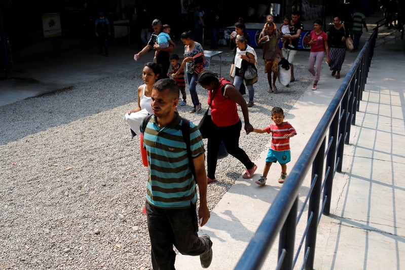 FILE PHOTO: People arrive to have lunch at an aid center and community kitchen where Venezuelans are assisted in Cucuta