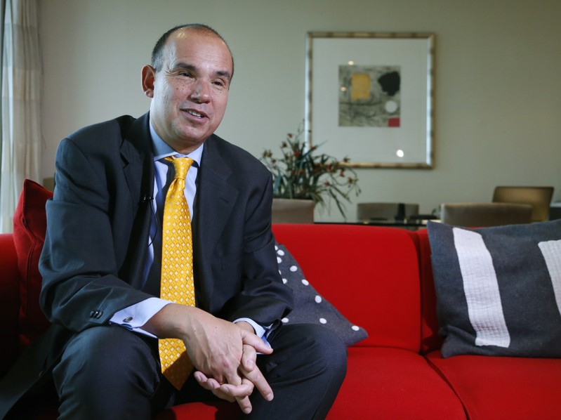 FILE PHOTO: Former CEO at Olympus Corporation Michael Woodford speaks with a Reuters reporter in London