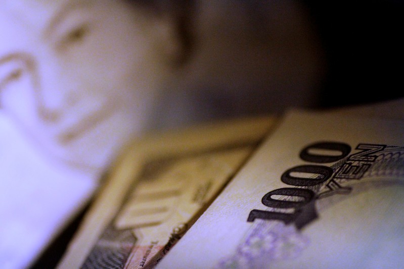 Illustration photo of a Japan Yen note in front of U.S. Dollar and British Pound Sterling notes