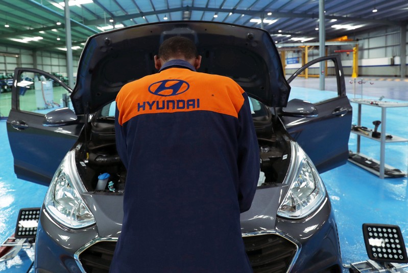 FILE PHOTO: An employee assembles a Hyundai car in Hyundai Marathon Motor assembly plant on the outskirt of Addis Ababa