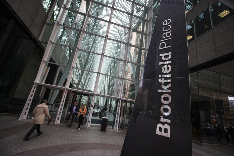 People walk to Brookfield Place off Bay Street on the day of the AGM for Brookfield Asset Management shareholders in Toronto