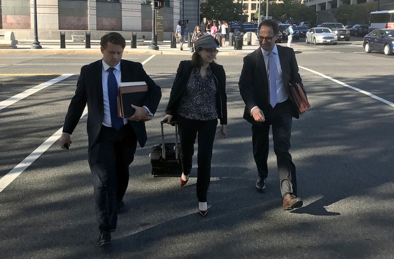 Freeny and Weissmann, members of special counsel Robert Mueller's team of prosecutors leave court in Washington D.C.