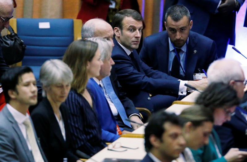 French President Emmanuel Macron sits among delegates at the United Nations Environment Assembly in Gigiri within Nairobi