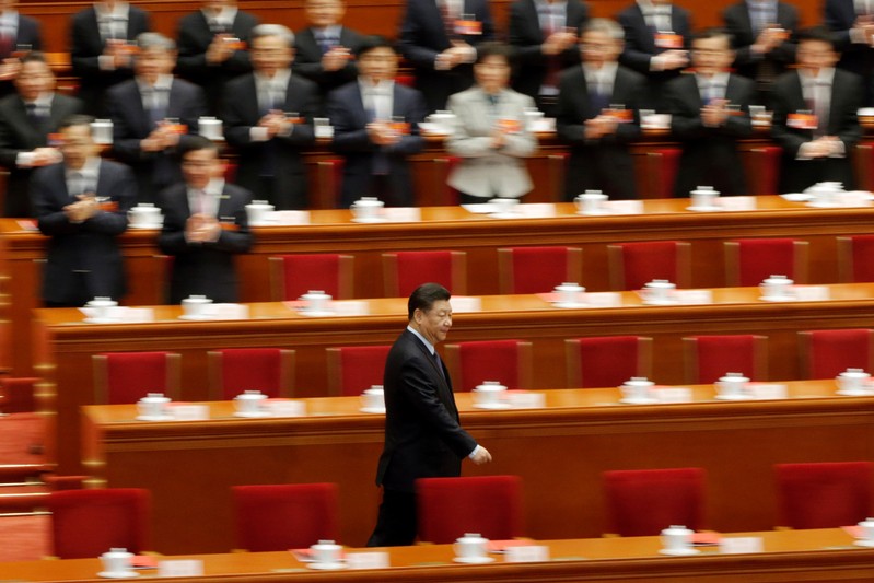 Chinese President Xi Jinping arrives for the closing session of the National People's Congress (NPC) at the Great Hall of the People in Beijing