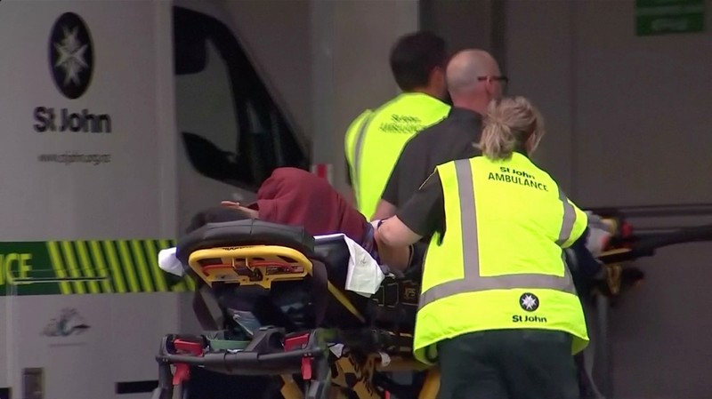 Video grab of emergency services personnel push stretchers carrying a person into a hospital, after reports that several shots had been fired, in central Christchurch