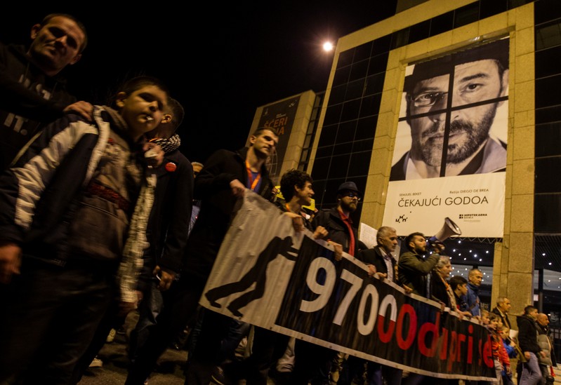 Demonstrators march during civic protest in Podgorica